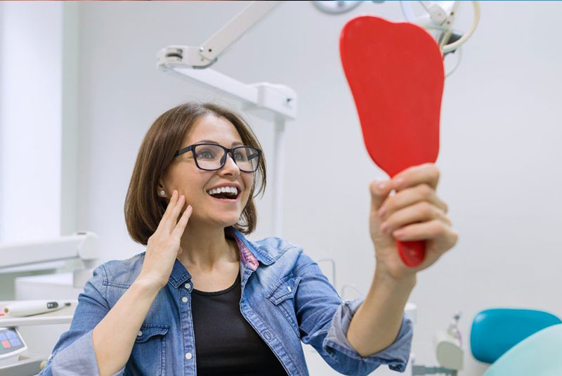patient smiling brightly after their dental procedure